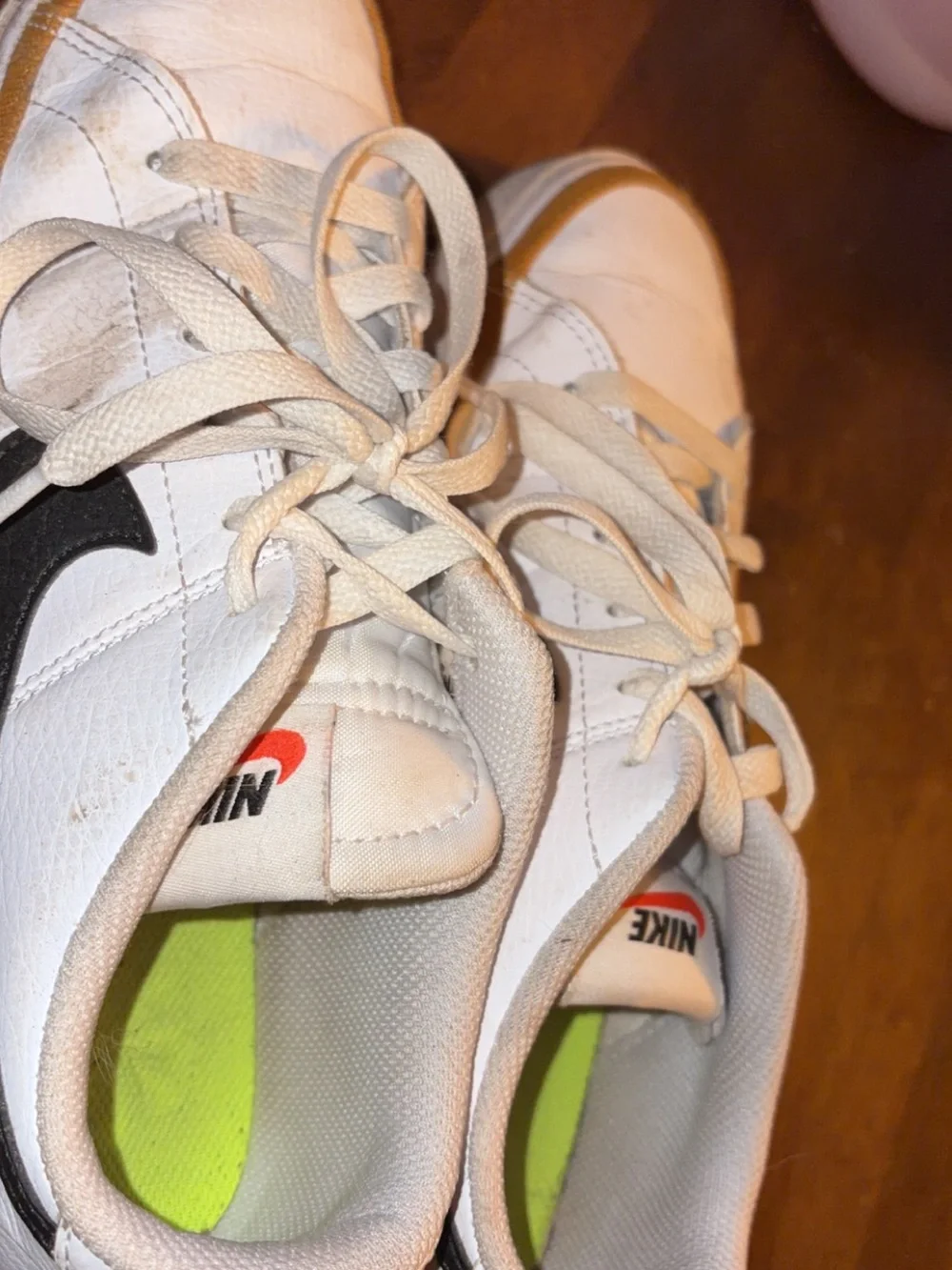 Nike Kids White Sneakers with Black Swoosh and Neon Green Insole